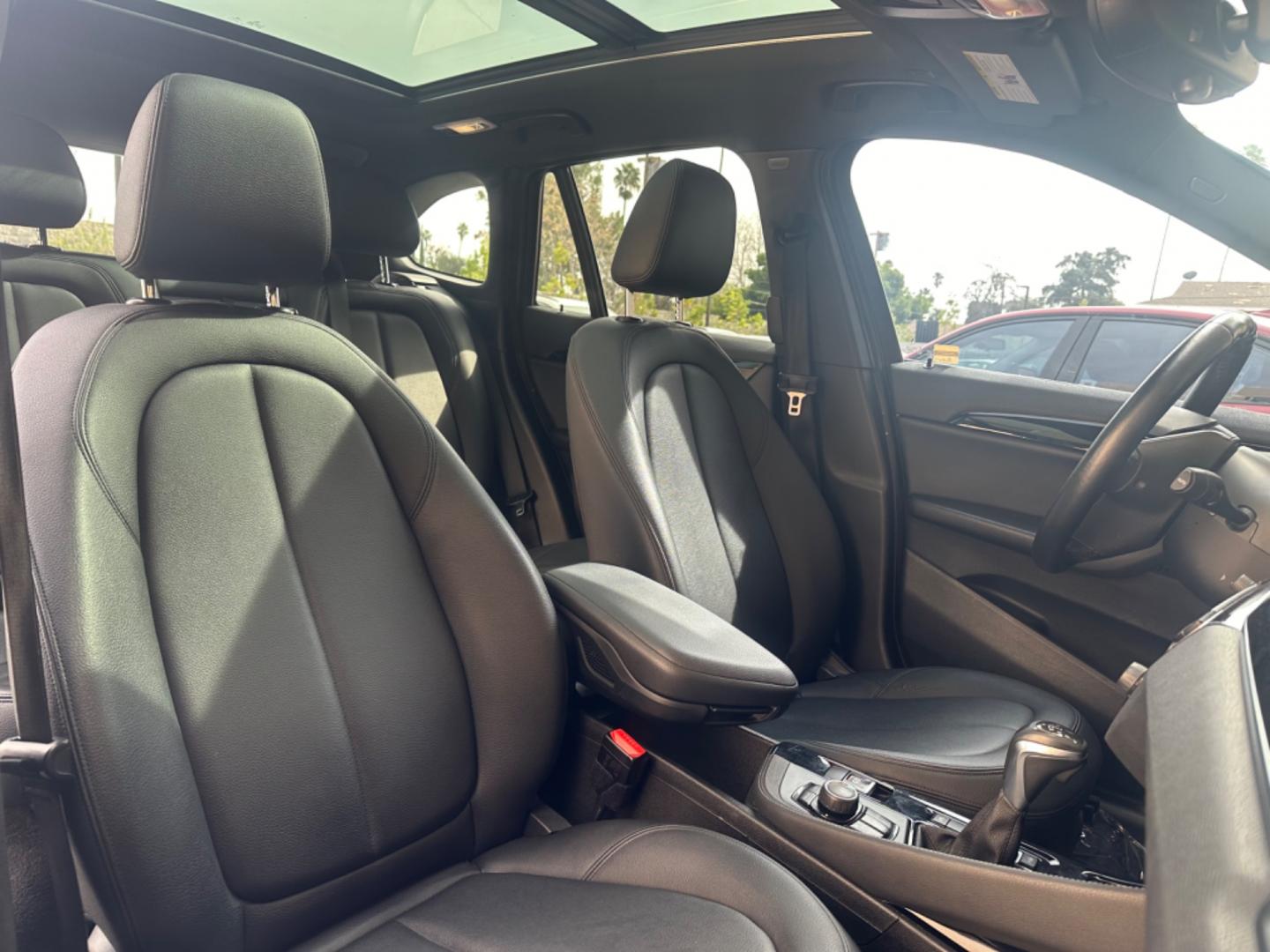 2016 Gray /Black BMW X1 leather (WBXHT3Z34G4) with an 4 CYLINDER engine, Automatic transmission, located at 30 S. Berkeley Avenue, Pasadena, CA, 91107, (626) 248-7567, 34.145447, -118.109398 - Crown City Motors is a used “Buy Here Pay Here” car dealer in Pasadena CA. “Buy Here Pay Here” financing, means that when you purchase your vehicle from our dealership, that you make the payments to the dealership as well. We do not need the banks approval to get you approved for a used auto - Photo#16